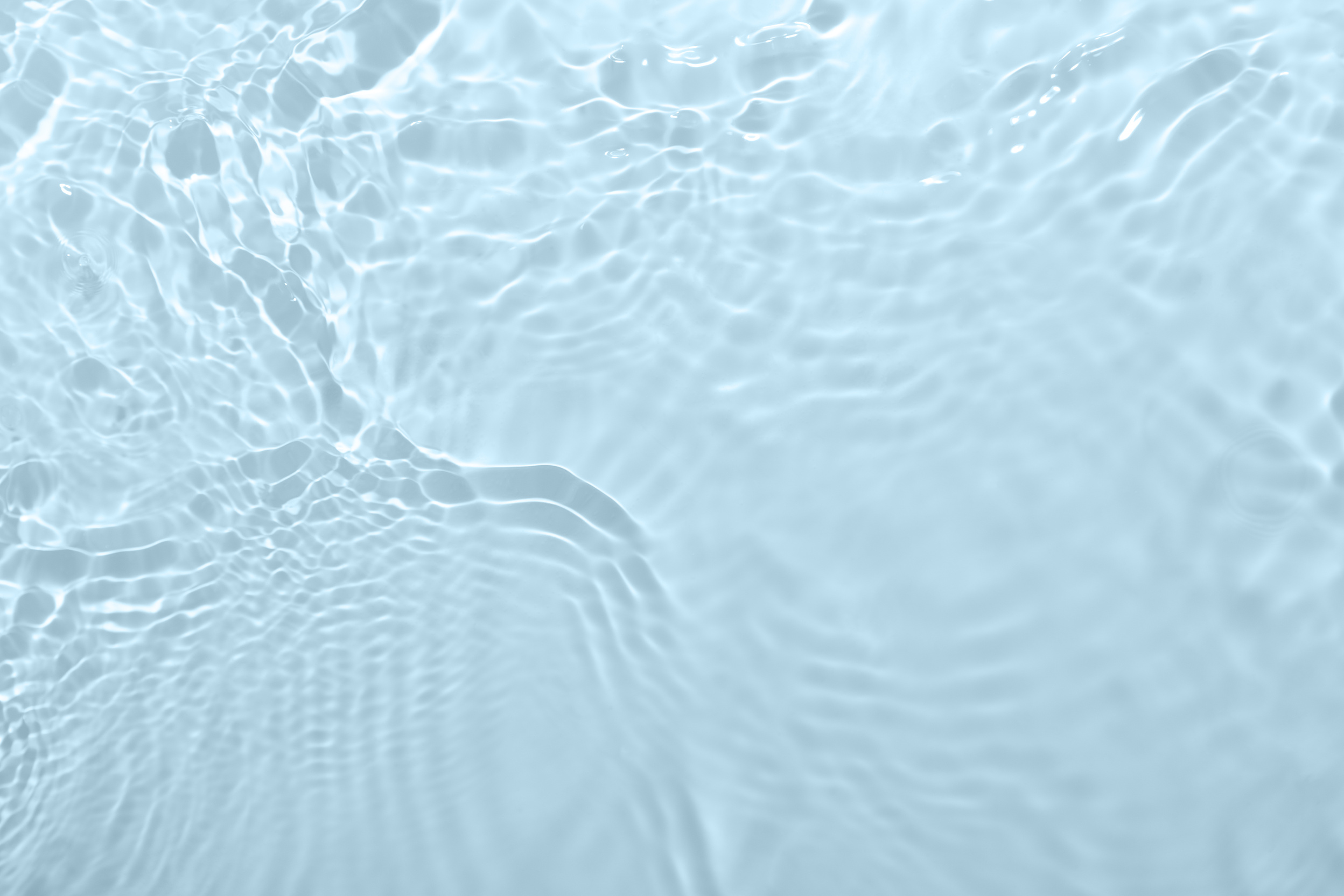 Fresh water background. Light blue rippled pattern